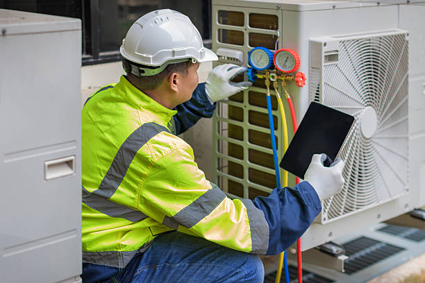 Professional Hvac technician working in Tooele, UT